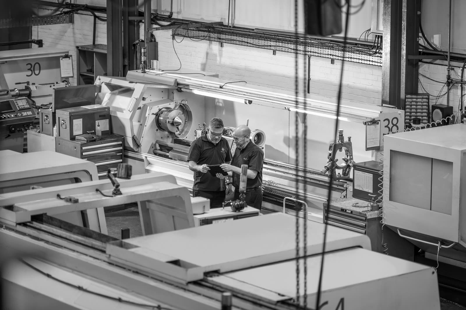 Machinists at work on the Hone-All shop floor in Leighton Buzzard